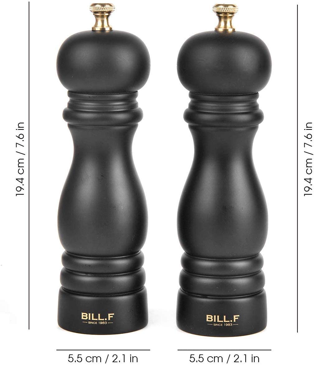 Wooden pepper mill on a dining table