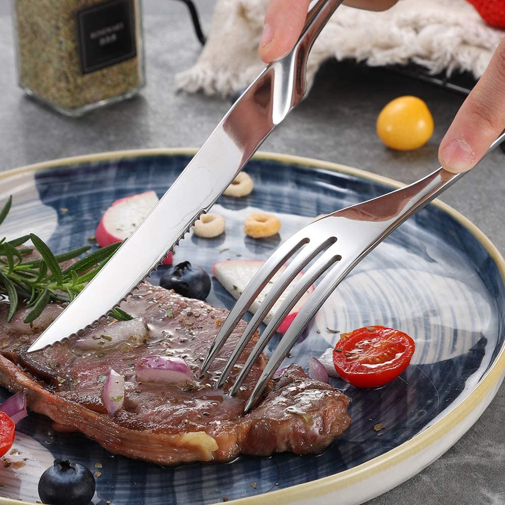 Steak knife cutting through steak