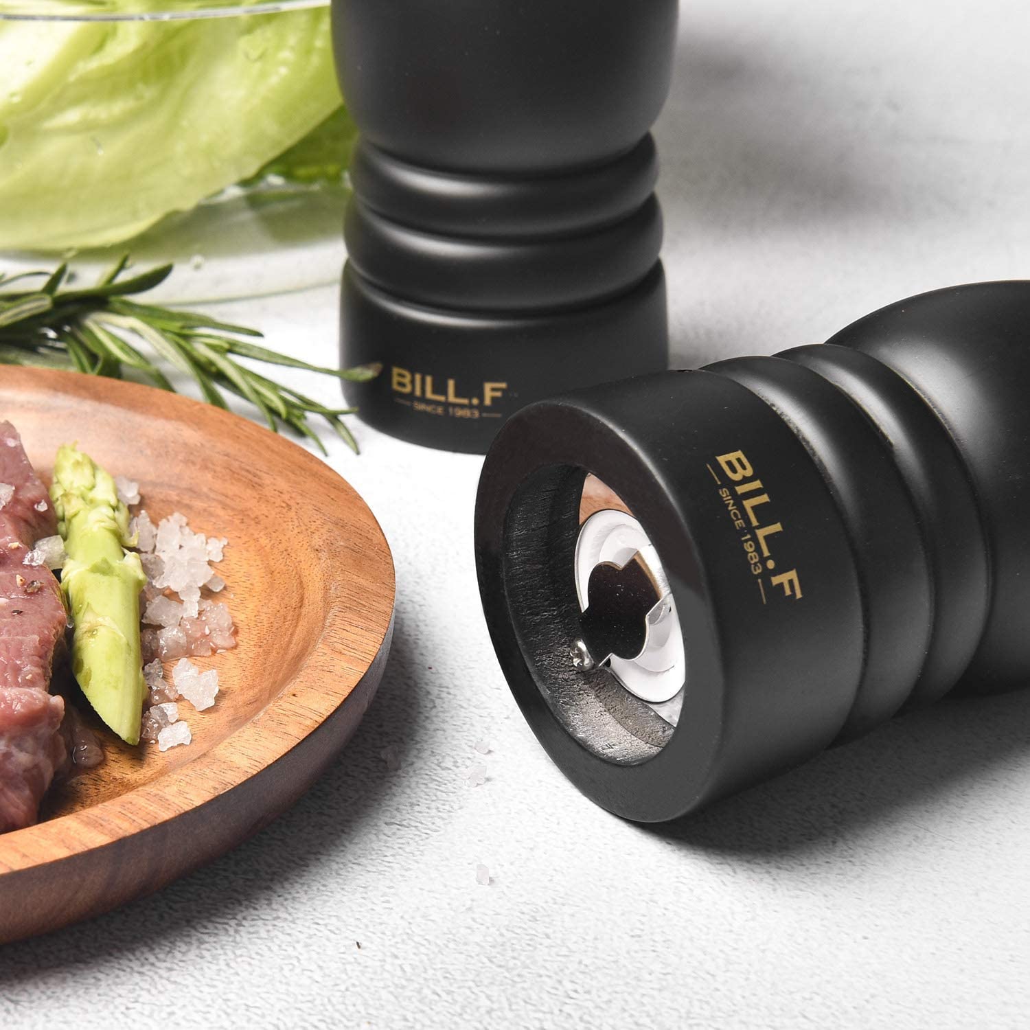 Salt and pepper grinders being filled