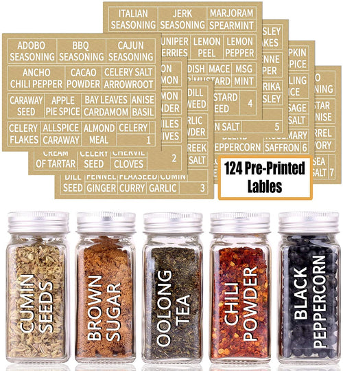 Square glass spice jars lined up on a shelf